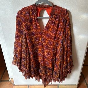 Free people tunic XS in orange floral pattern flowy sleeves